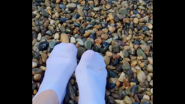 XXX Playing with my feet in white socks with pebbles on the beach top Videos